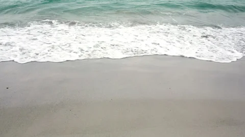 Ocean rolling in over the beach Stock Footage 34677797