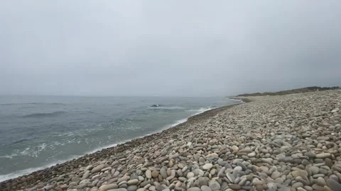 Ocean Rolling Pebbles on Calm Beach 🌊 – Peaceful Coastal View Stock Footage 311110584