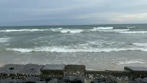 Ocean rolling weaves on rock beach, Ocean beach, sea beach, sand beach Stock Footage 167739096