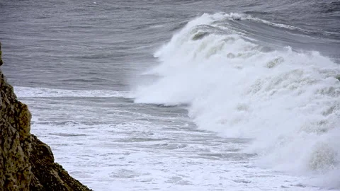 The ocean is rough and choppy, with waves crashing against the shore Stock Footage 298267039