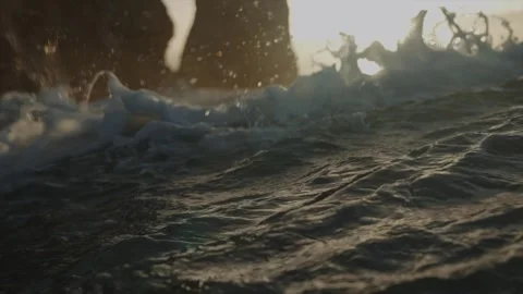 The ocean is rough and choppy, with waves crashing against the rocks Stock Footage 298268902