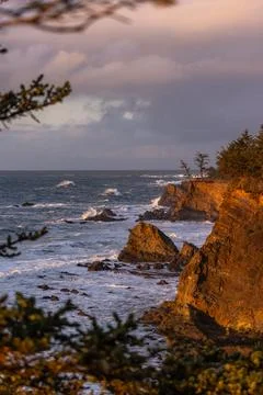 The ocean is rough and the sky is cloudy Stock Photos