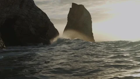 The ocean is rough and the waves are crashing against the rocks Stock Footage 298268966