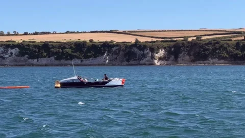 Ocean rowing vessel being rowed into Studland Bay 스톡 동영상 341483078