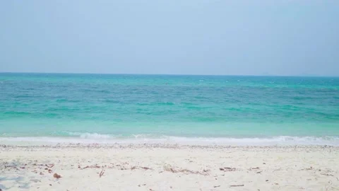 Ocean sandy beach and blue water, Waves hit the beautiful sandy beach of Jomtien Stock Footage 234042092