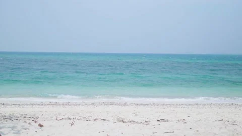 Ocean sandy beach and blue water, Waves hit the beautiful sandy beach of Ko Kham Stock Footage 240534106