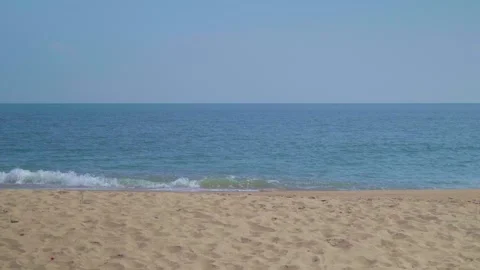 Ocean sandy beach and blue water, Waves hit the beautiful sandy beach Stock Footage 260286553