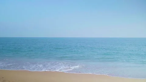 Ocean sandy beach and blue water, Waves hit the beautiful sandy beach Stock Footage 260287113