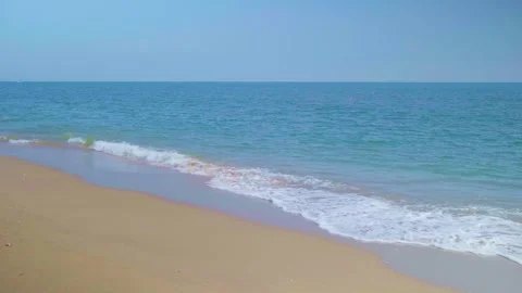 Ocean sandy beach and blue water, Waves hit the beautiful sandy beach Stock Footage 260287230