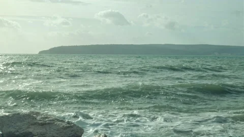 Ocean is shaking during a storm with gusty winds waves splashing on a Beach Stock Footage 230487104
