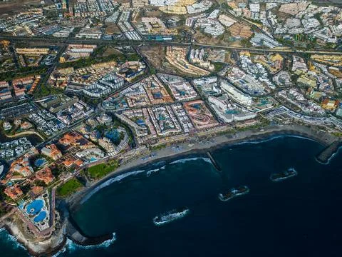 Ocean shore, coast line with hotels, blue water of Costa Adeje, Tenerife, Canary Stock Photos