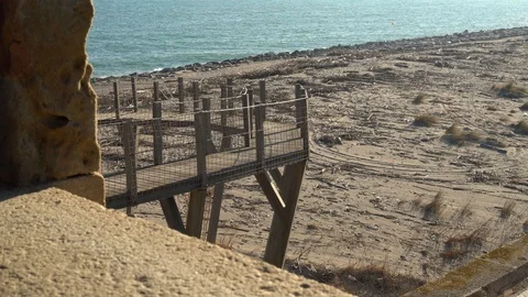 Ocean shore, window view through a stone wall Stock Footage 127134069