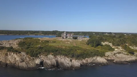 Ocean Shoreline Rock Cliffs with House in background Video stock 116347349