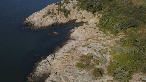 Ocean Shoreline Rock Cliffs with Waves Crashing Stock Footage 116347106