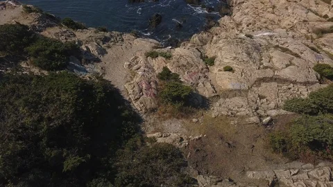 Ocean Shoreline Rock Cliffs with Waves Crashing Stock Footage 116347180