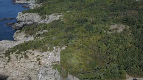 Ocean Shoreline Rock Cliffs with Waves Crashing Stock Footage 116347273