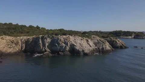 Ocean Shoreline Rock Cliffs with Waves Crashing Stock Footage 116347299