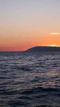 Ocean small waves on sunset lights. 库存照片