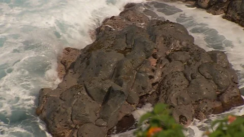 Ocean smoothed rocks. Getting hit by waves. cu Stock Footage 102526082