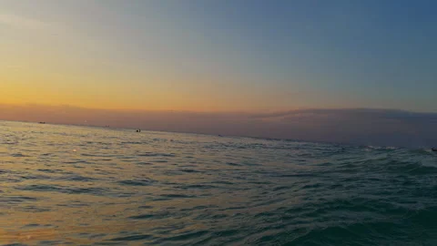 Ocean Spray and Water Droplets Exploding Around the Camera During a Sunset Wave Stock Footage 337027797