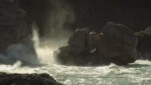 Ocean spray hitting large rocks on Mediterranean coast Stock Footage 168775272