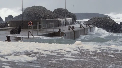 Ocean Storm Rages over Tiny Harbour at Ballintoy Causeway Coast Northern Ireland Stock Footage 98501136