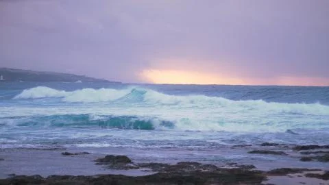 Ocean before the storm at sunset Stock Photos