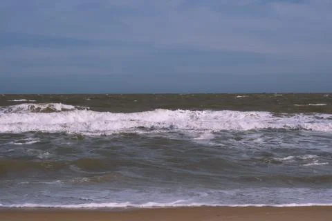 Ocean storm waves dramatically crashing splashing. Sky horizon line. Sea water Stock Photos
