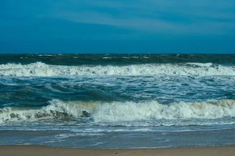 Ocean storm waves dramatically crashing splashing. Sky horizon line. Sea water Stock Photos
