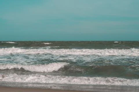 Ocean storm waves dramatically crashing splashing. Sky horizon line. Sea water Stock Photos