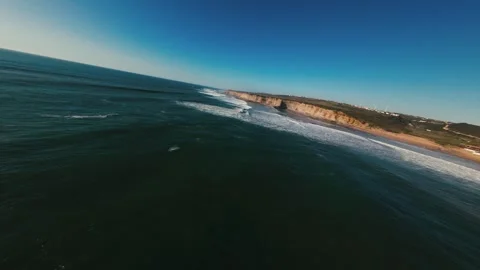 Ocean stretches wide under clear blue sky Stock Footage 339786372