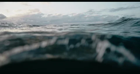 Ocean strong waves at cloudy sunset. Majesty and beauty of nature. Filmed on RED Stock Footage 124988624