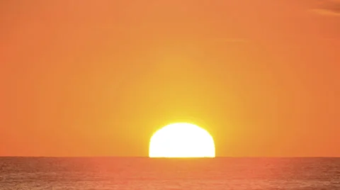 Ocean sunrise in clear sky time lapse zoom for big sun 4K version Stock Footage 32303108