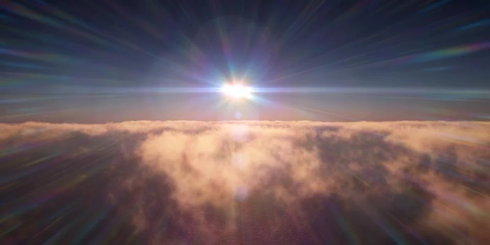 Ocean sunset above clouds Stock Photos