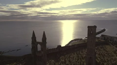 Ocean sunset aerial view over an old derelict structure and graveyard Video stock 237629662