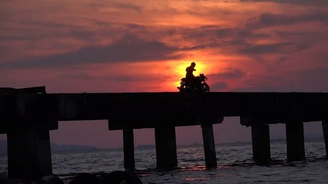 Ocean sunset and motorcycle. Stock Footage 82350968