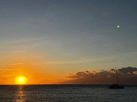 Ocean Sunset with boat Stock Photos
