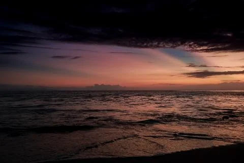 Ocean at Sunset with Dramatic Sky, Rippling Water, and Cloud Formations Ref.. Stock Photos