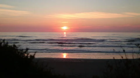 OCEAN SUNSET OR SUNRISE SHOT WITH LIGHT REFLECTING IN WATER; ORANGE Stock Footage 59071424