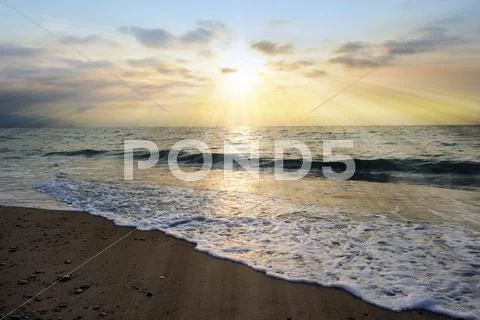 Ocean Sunset Rays Stock Photos