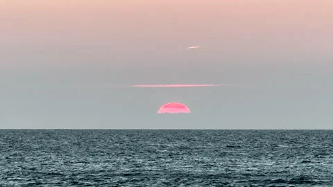 Ocean Sunset with Red Sun on Horizon, Etretat Normandy France, Steady Cam Shot Video stock 345118332
