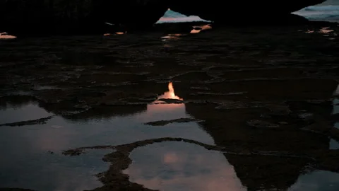 Ocean sunset reflection in coastal rock pool Stock Footage 303395142