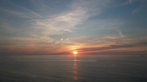 Ocean sunset with reflection of setting sun on sea surface Stock Footage 250483998