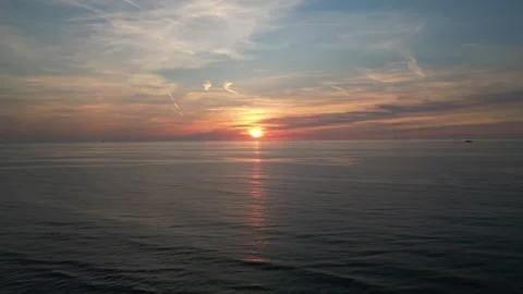Ocean sunset with reflection of setting sun on sea surface Stock Footage 250484005