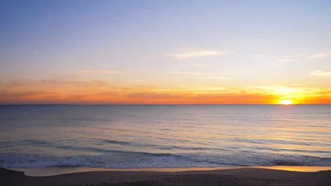 Ocean at sunset, sandy beach pink sky, holiday destination in 4k Stock Footage 109162513