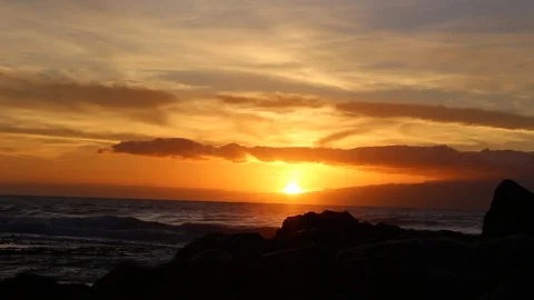 Ocean sunset with silhouette, cloud and yellow, orange and red sky. Stock Footage 97939289
