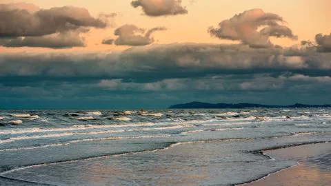 Ocean sunset before storm. Dramatic sky. Stock Photos