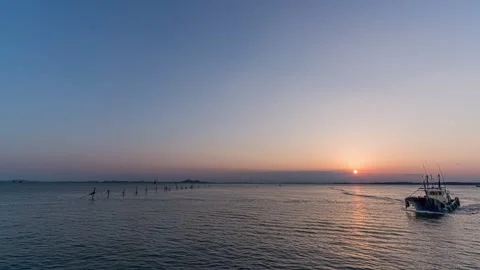Ocean Sunset Time-lapse with Golden Horizon and Dramatic Clouds Movement Stock Footage 326697346