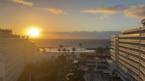 Ocean sunset view between luxury hotels with palm trees and beach resort in Tene Stock Footage 335047729