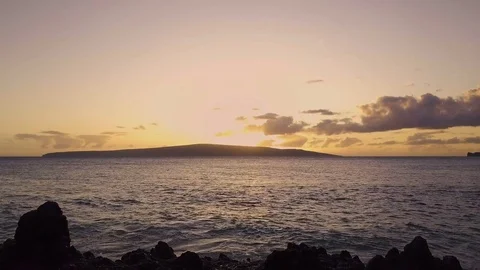 Ocean Sunset With Volcanic Rocks And A Pond Reflection In The Foreground Video stock 85153155